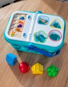 Baby Einstein Hape Magic Touch Shopping Basket aktivnostna igrača 9 m+ 1 kos