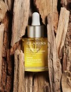 Clarins Santal Face Treatment Oil pomirjajoče in regeneracijsko olje za suho kožo 30 ml