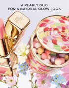 GUERLAIN KissKiss Bee Glow hranilni in vlažilni balzam za ustnice odtenek 389 Pearly Peach 3.2 g