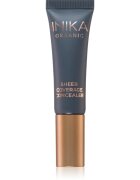 Inika Organic Sheer Coverage kremasti prekrivni korektor proti podočnjakom odtenek Porcelain 10 ml