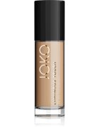 JOKO Luminous Touch lahki tekoči puder za poenoten odtenek kože odtenek 104 Warm Honey 30 ml