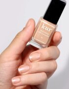 LONDONTOWN Kur Illuminating Nail Concealer posvetlitveni lak za nohte odtenek Bare 12 ml