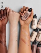 MAC Cosmetics Studio Radiance Face and Body Radiant Sheer Foundation lahek tekoči puder za obraz in telo odtenek N2 50 ml