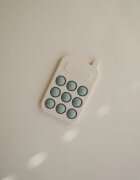 Mushie Pop-It Phone aktivnostna igrača za otroke Cambridge Blue 10m+ 1 kos