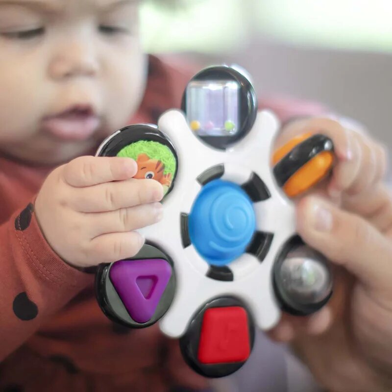 Baby Einstein Curiosity Clutch Twist & Pop aktivnostna igrača 3 m+ 1 kos