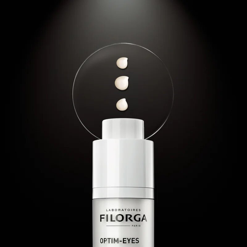FILORGA OPTIM-EYES nega za predel okoli oči proti gubam zabuhlosti in temnim kolobarjem 15 ml
