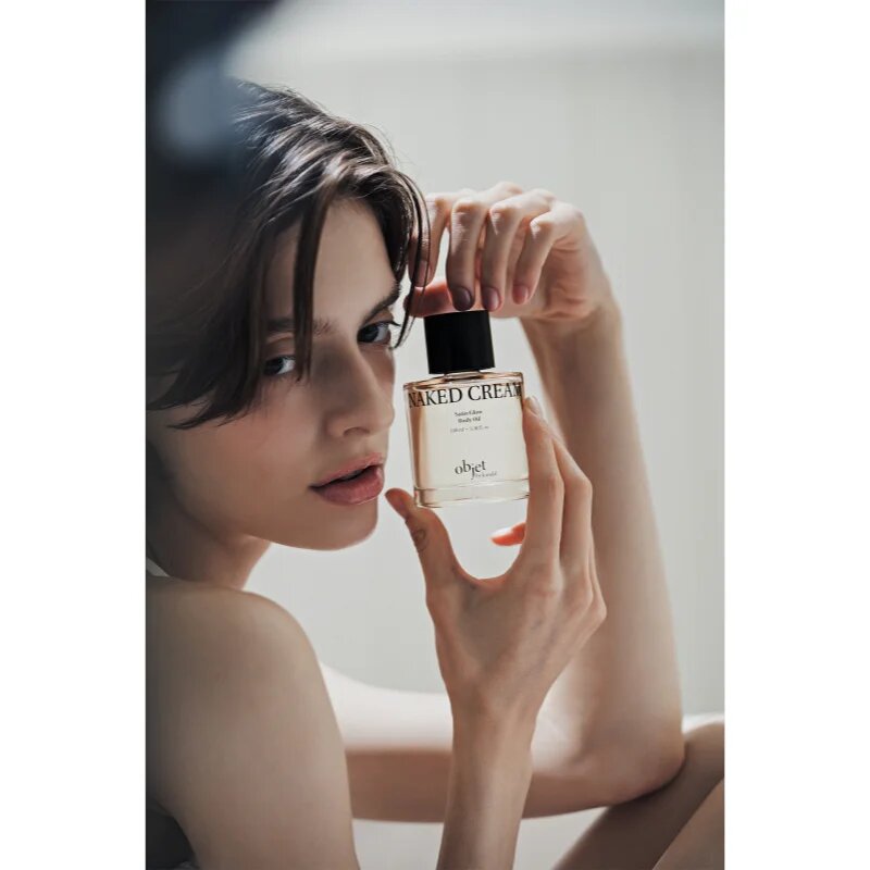 KUNDAL Objet Satin Glow Body Oil negovalno olje za telo za intenzivno vlažnost z vonjem Naked Cream 100 ml