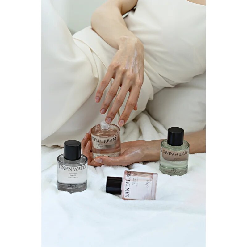 KUNDAL Objet Satin Glow Body Oil negovalno olje za telo za intenzivno vlažnost z vonjem Naked Cream 100 ml