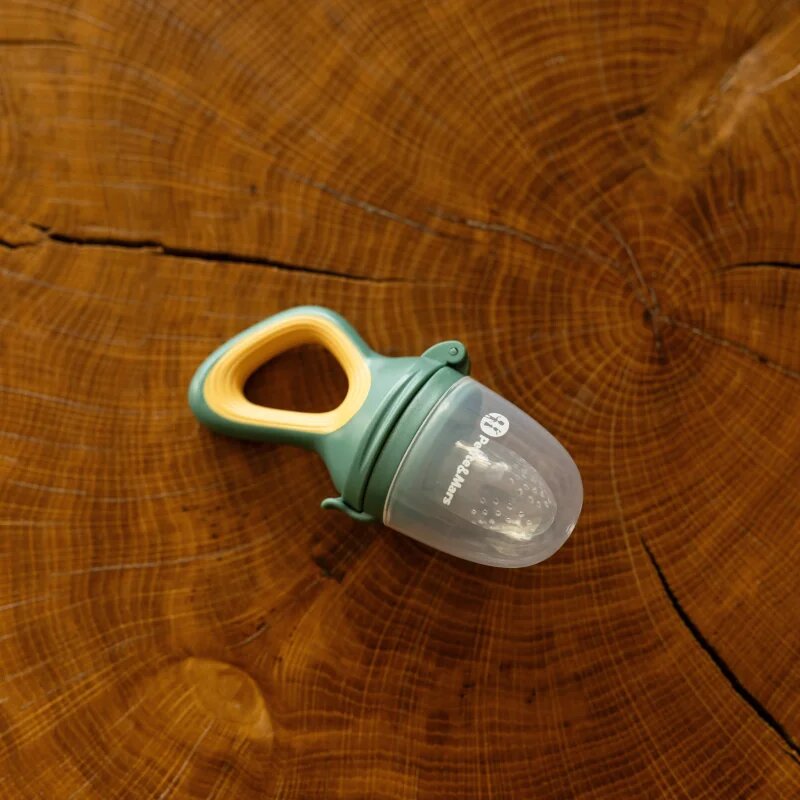 Petite&Mars Silicone Food Feeder 6m+ duda za hranjenje in grizalo Green&Ochre 1 kos